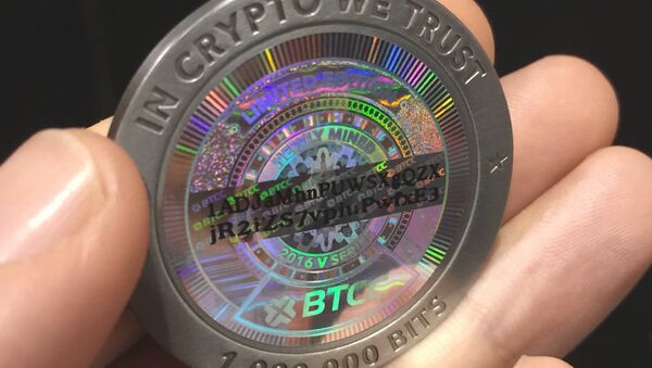 Una criptomoneda (imagen referencial) - Sputnik Mundo