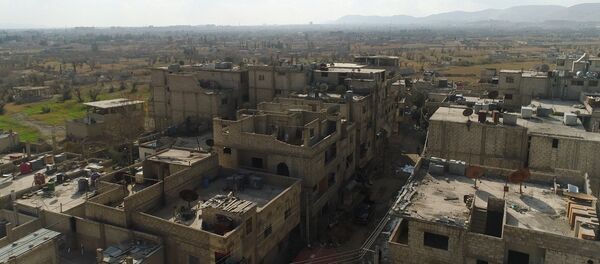 Un corredor humanitario entre Damasco y Guta Oriental en la zona del campo para los refugiados Wafidin - Sputnik Mundo