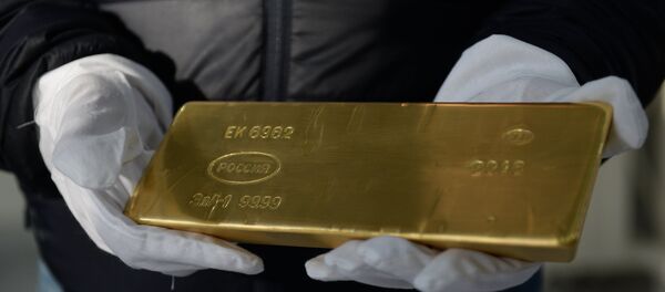 Un lingote de oro - Sputnik Mundo