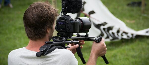 Un camarógrafo - Sputnik Mundo