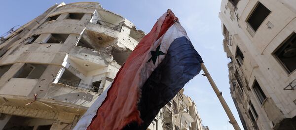 La bandera de Siria en Guta Oriental - Sputnik Mundo