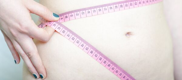 Una cinta de medir - Sputnik Mundo