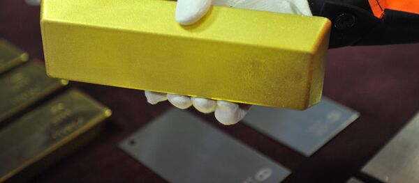 Un lingote de oro - Sputnik Mundo