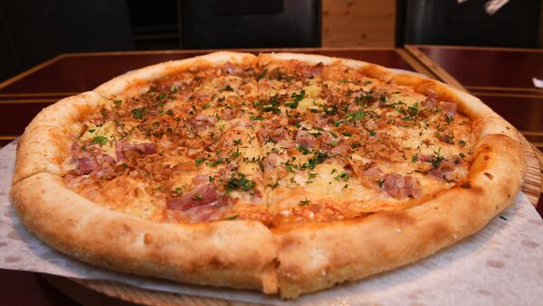 Pizza en el restaurante RIS - Sputnik Mundo