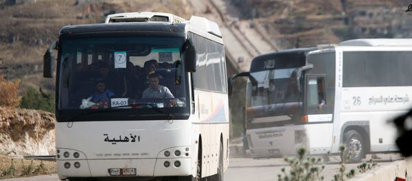 La evacuación de radicales en Siria (Archivo) - Sputnik Mundo