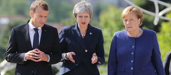Presidente de Francia, Emmanuel Macron, primera ministra del Reino Unido, Theresa May y canciller de Alemania, Angela Merkel - Sputnik Mundo