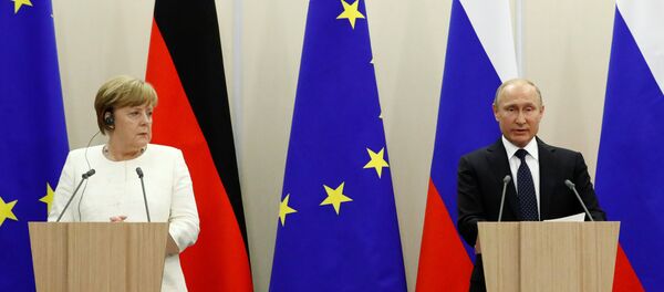 El presidente de Rusia, Vladímir Putin y la canciller de Alemania, Angela Merkel - Sputnik Mundo