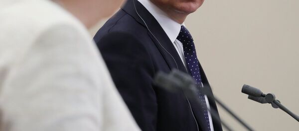 La canciller de Alemania, Angela Merkel, y el presidente de Rusia, Vladímir Putin La canciller de Alemania, Angela Merkel, y el presidente de Rusia, Vladímir Putin - Sputnik Mundo