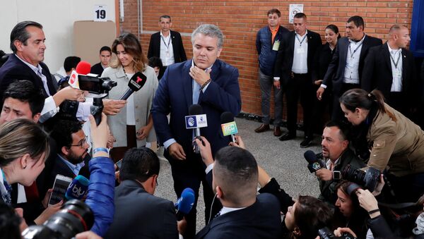 Iván Duque durante la jornada electoral del 27 de mayo - Sputnik Mundo