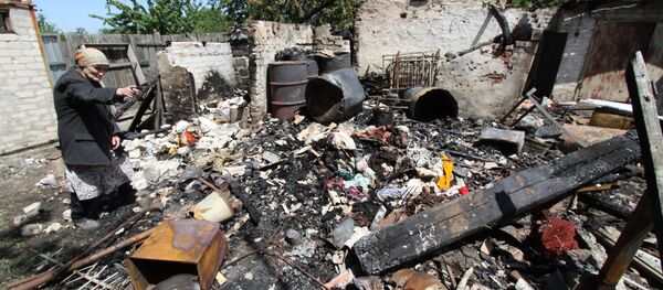 Consecuencias del bombardeo en Docuchayevsk, este de Ucrania, 28 de mayo de 2018 Consecuencias del bombardeo en Docuchayevsk, este de Ucrania, 28 de mayo de 2018 - Sputnik Mundo