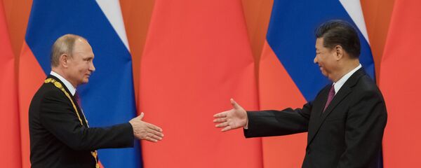 Presidente de Rusia, Vladimir Putin y el presidente de China, Xi Jinping - Sputnik Mundo