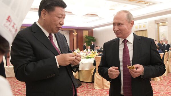 Presidente de China, Xi Jinping, y presidente de Rusia, Vladímir Putin - Sputnik Mundo