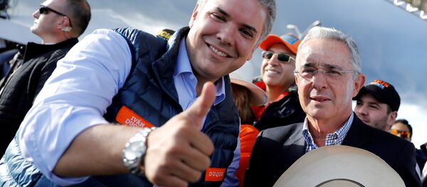 Presidente electo de Colombia Iván Duque y expresidente Álvaro Uribe - Sputnik Mundo