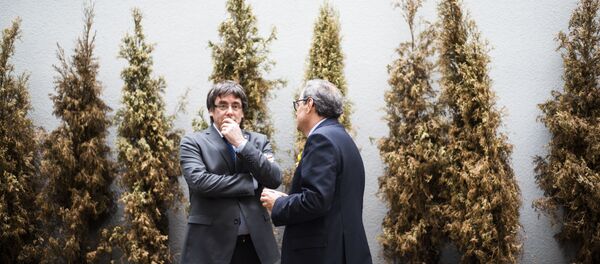 El expresidente de Cataluña, Carles Puigdemont, y el actual presidente del Gobierno catalán, Quim Torra - Sputnik Mundo
