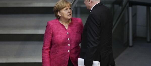 Ángela Merkel, canciller de Alemania, y Horst Seehofer, ministro del Interior y líder de la Unión Social Cristiana de Baviera - Sputnik Mundo
