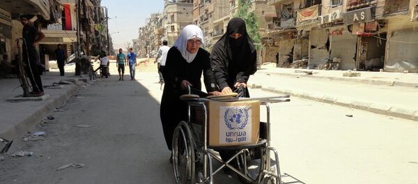 Refugiados palestinos con la ayuda humanitaria de la UNRWA - Sputnik Mundo