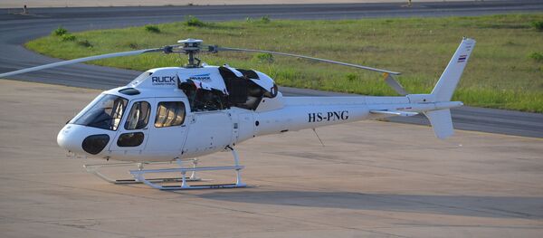 Un helicóptero - Sputnik Mundo