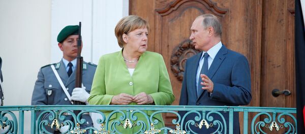 Angela Merkel y Vladímir Putin - Sputnik Mundo