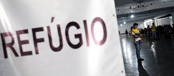 Un migrante venezolano venezolano - Sputnik Mundo