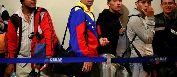 Migrantes venezolanos (archivo) Migrantes venezolanos (archivo) - Sputnik Mundo