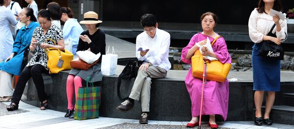 Los ciudadanos de Tokio, Japón - Sputnik Mundo