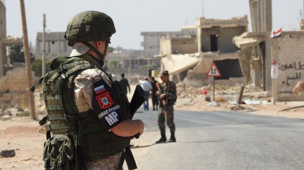 Un militar ruso - Sputnik Mundo