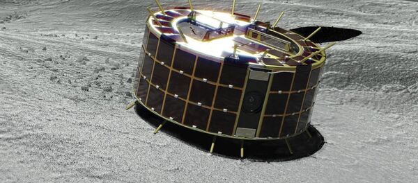 Esta imagen gráfica muestra dos rovers Minerva-II-1 con forma de tambor en un asteroide Esta imagen gráfica muestra dos rovers Minerva-II-1 con forma de tambor en un asteroide - Sputnik Mundo