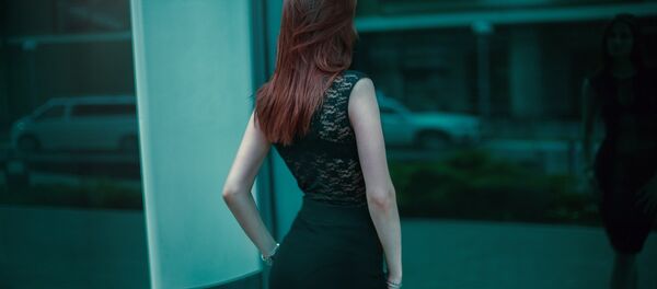 Una mujer - Sputnik Mundo