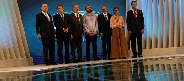 Candidatos durante el debate electoral en Brasil - Sputnik Mundo