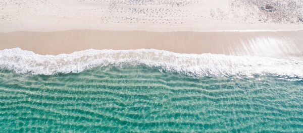 Una playa (imagen referencial) - Sputnik Mundo