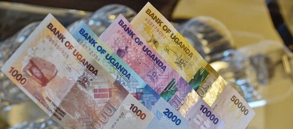 El dinero de Uganda, referencial - Sputnik Mundo