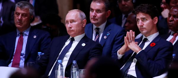 Hashim Thaci y Vladímir Putin durante el centenario del fin de la Primera Guerra Mundial en París - Sputnik Mundo