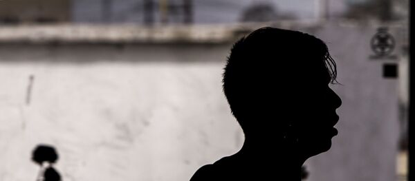 Migrante en uno de los albergues saturados en la ciudad fronteriza - Sputnik Mundo