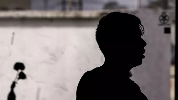 Migrante en uno de los albergues saturados en la ciudad fronteriza