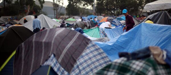Migrantes centroamericanos en Tijuana Migrantes centroamericanos en Tijuana - Sputnik Mundo