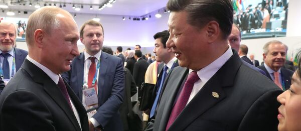 Vladímir Putin, presidente de Rusia, y Xi Jinping, líder chino - Sputnik Mundo
