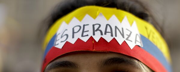 Una manifestante venezolana - Sputnik Mundo
