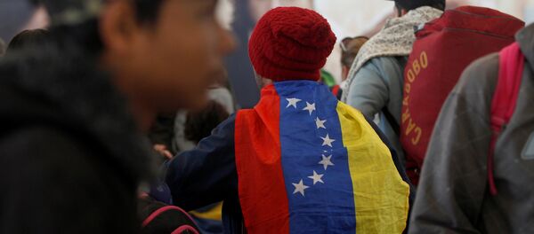Migrantes venezolanos en Ecuador Migrantes venezolanos en Ecuador - Sputnik Mundo