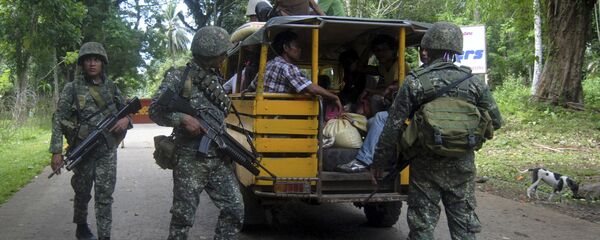 Militares filipinos en un puesto de seguridad en la isla de Joló, Filipinas (archivo) Militares filipinos en un puesto de seguridad en la isla de Joló, Filipinas (archivo) - Sputnik Mundo