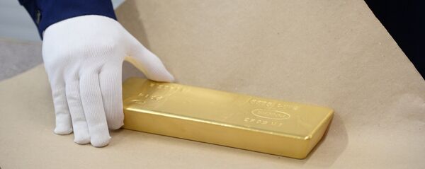 Un lingote de oro Un lingote de oro - Sputnik Mundo