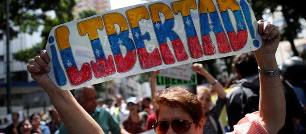 Protestas contra el presidente venezolano, Nicolás Maduro, en Caracas - Sputnik Mundo