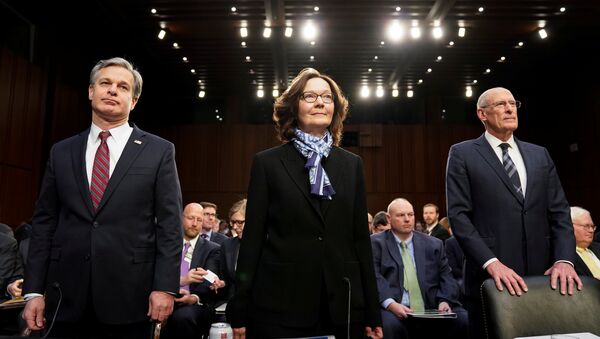 El director de Inteligencia Nacional, Dan Coats, la directora de la CIA, Gina Haspel, y el director del FBI, Christopher Wray - Sputnik Mundo