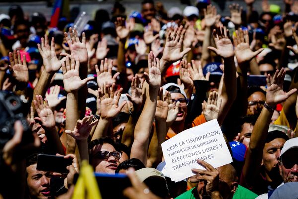 Las dos caras de Caracas: las manifestaciones con los partidarios de Maduro y Guaidó - Sputnik Mundo