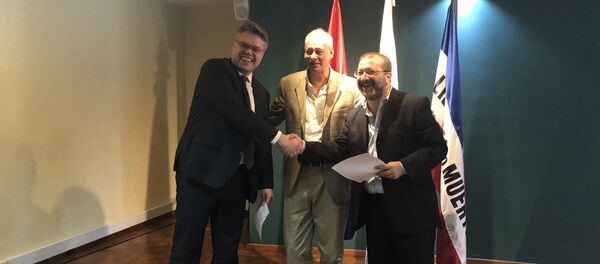 El jefe del Centro de Proyectos Internacionales, Vasili Pushkov, el viceministro ruso de Desarrollo Digital, Comunicaciones y Medios de Comunicación, Alexéi Volin, y el presidente del Servicio de Comunicación Audiovisual Nacional de Uruguay, Ernesto Kreimerman - Sputnik Mundo