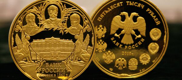 Unas monedas de oro del Banco de Rusia (archivo) - Sputnik Mundo