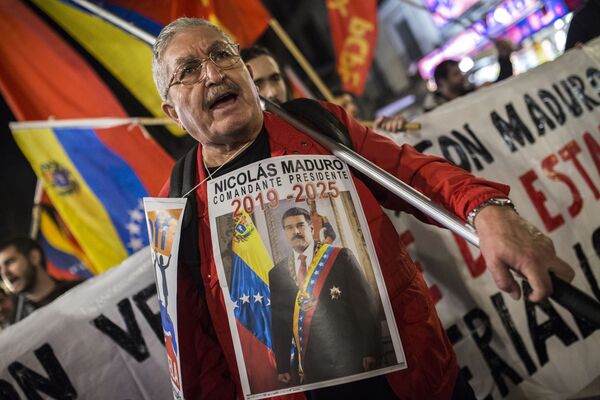 La manifestación en Madrid a favor de Maduro La manifestación en Madrid a favor de Maduro - Sputnik Mundo