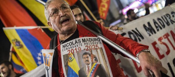 La manifestación en Madrid a favor de Maduro La manifestación en Madrid a favor de Maduro - Sputnik Mundo
