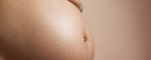 Una mujer embarazada - Sputnik Mundo