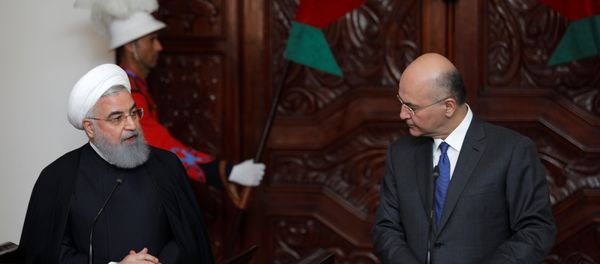 El presidente iraní, Hasán Rohani, con su homólogo iraquí, Barham Saleh - Sputnik Mundo