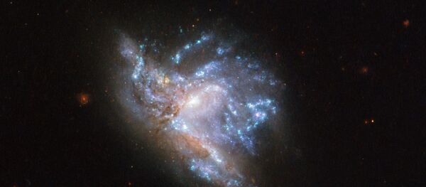 Dos galaxias de la constelación de Hércules colisionan Dos galaxias de la constelación de Hércules colisionan - Sputnik Mundo